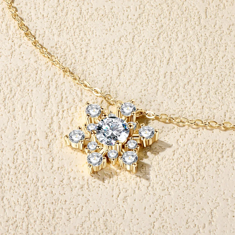 Bijou flocon de neige en or