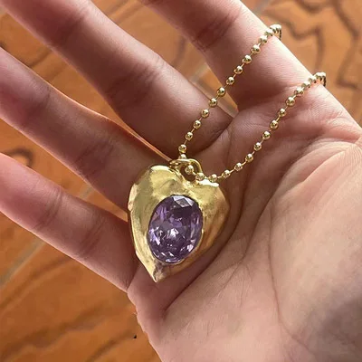 Pendentif en cuivre et or avec pierre d'améthyste